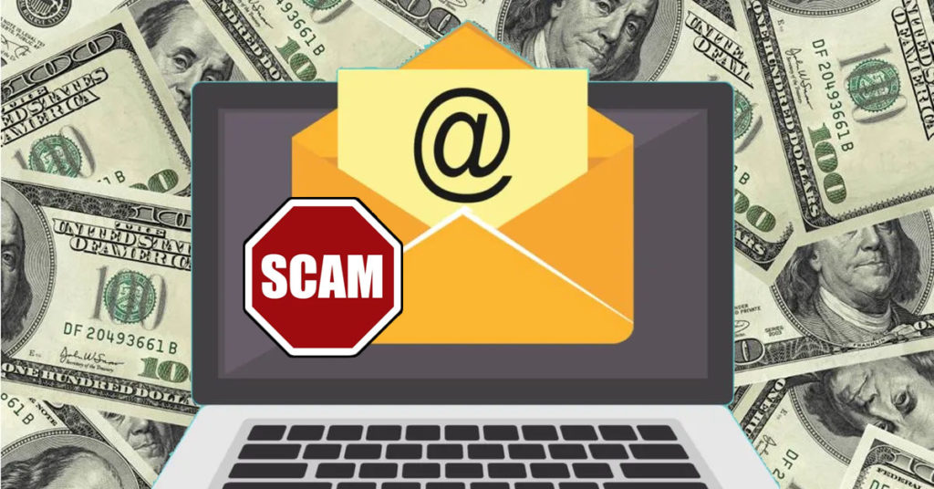 Computer on money with email and scam alert